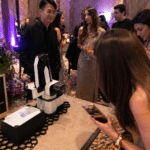 AI photo booth rental Bangkok with Sketch Bot creating live portrait sketches for guests at an event