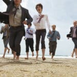 TeamBuilding Phuket participants running on the beach during a corporate team building activity
